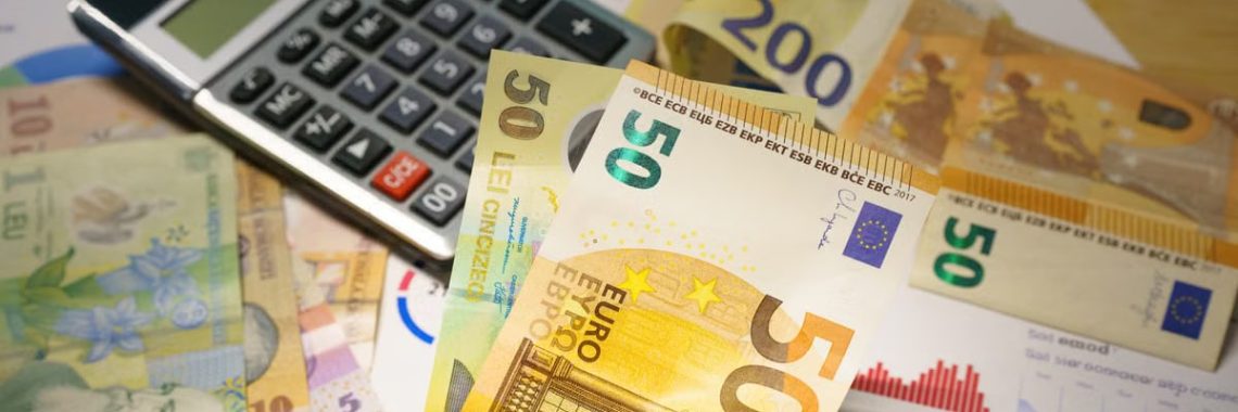 Euro and Romanian Lei currency with calculator on a financial desk setup.